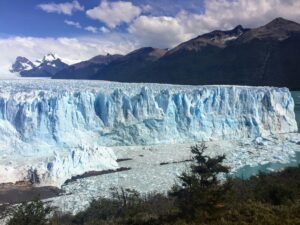 Majestic Perito Moreno Glacier under a vibrant sky, showcasing natural beauty and climate change impact.